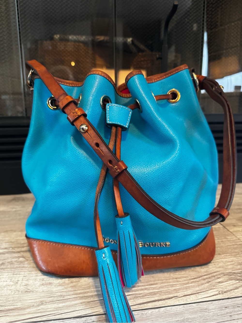 Dooney & Bourke Claremont bucket bag teal and natural leather drawstring
